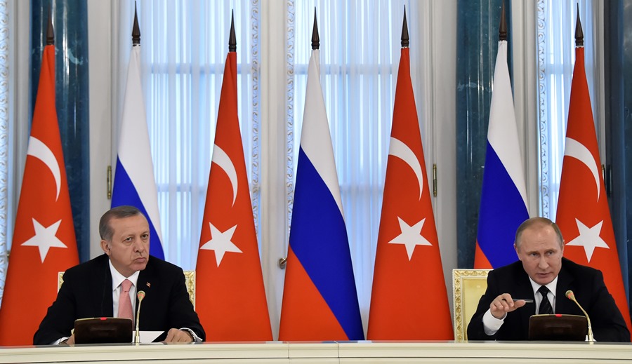 Erdoğan and Putin met for the first time after the Su-24 jet crisis in St. Petersburg on August 9, 2016 to normalize bilateral relations.  AFP PHOTO / ALEXANDER NEMENOV
