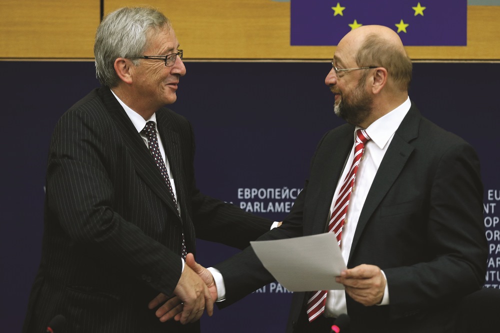 Newly elected President of the European Commission, Jean-Claude Juncker (L) is congratulated by the European Parliament President Martin Schulz during a press conference on July 15, 2014, in the European Parliament in Strasbourg,  eastern France. AFP / Frederick Florin